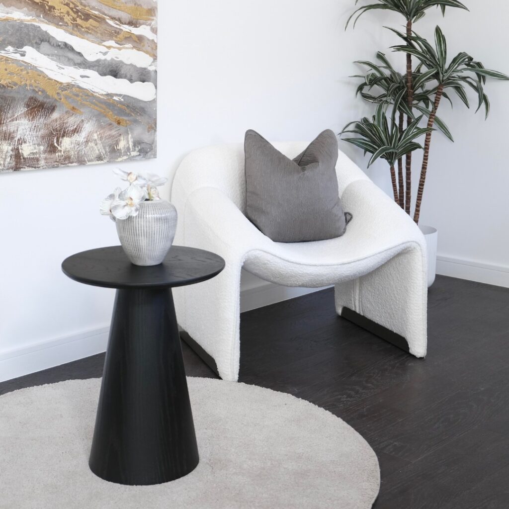 Finn Side Table placed beside a modern armchair