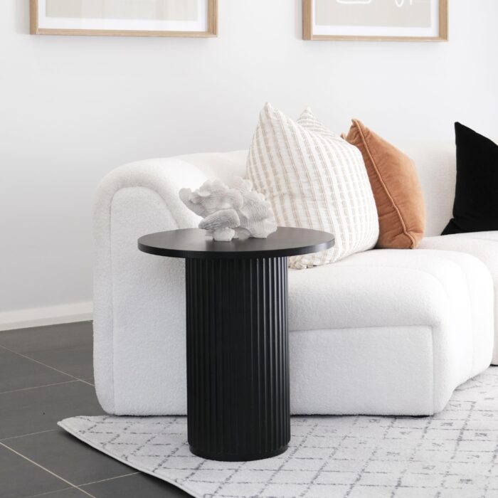 Juno Side Table with wood finish next to modern white sofa