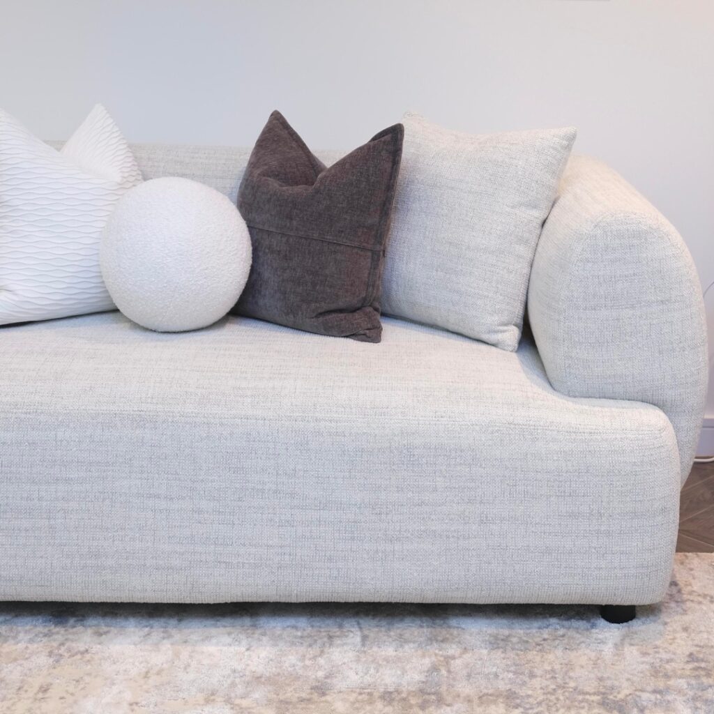 Modern living room setup featuring Luna 3-Seater Sofa with cushions