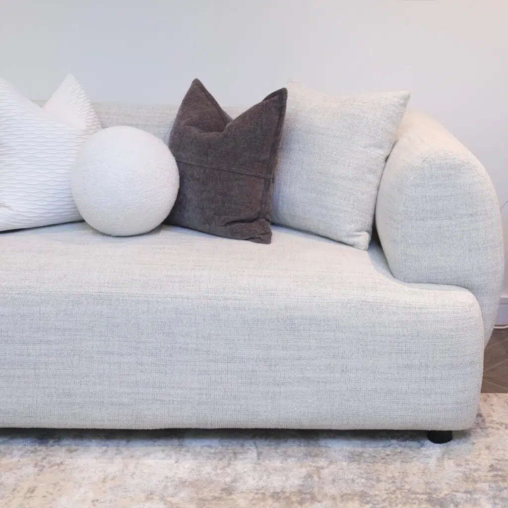 Modern living room setup featuring Luna 3-Seater Sofa with cushions