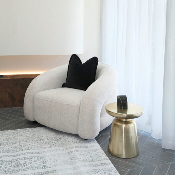 Cozy living room setup featuring the Mira Armchair