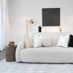 Elegant Mira Sofa styled with décor in a neutral interior