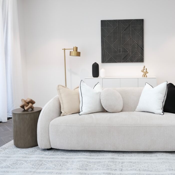 Elegant Mira Sofa styled with décor in a neutral interior