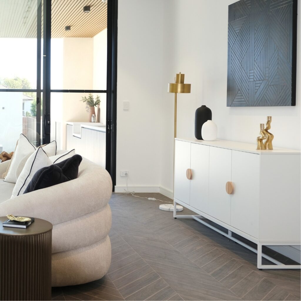 Buffet cabinet used for storage and decor in open living-dining area
