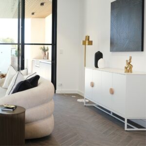 Buffet cabinet used for storage and decor in open living-dining area