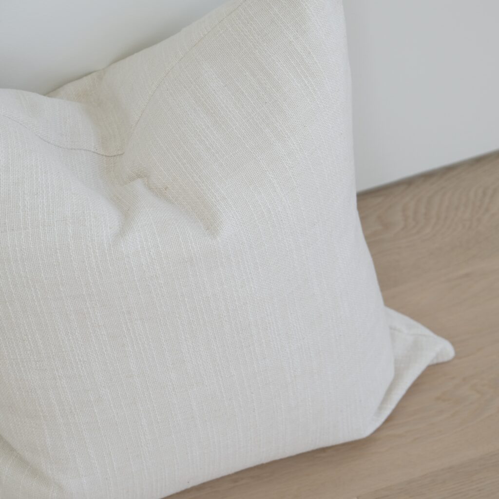 55cm x 55cm cushion with soft feather filling and removable cover