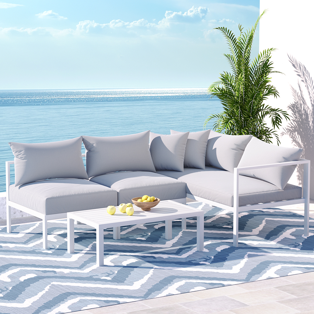 Aluminium 4-seater outdoor lounge set with cushions and coffee table, modular design, durable frame, for patio or garden.