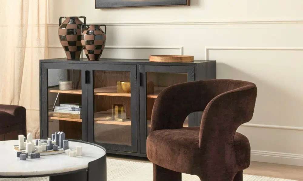 Black buffet with tempered glass doors placed in a modern living room