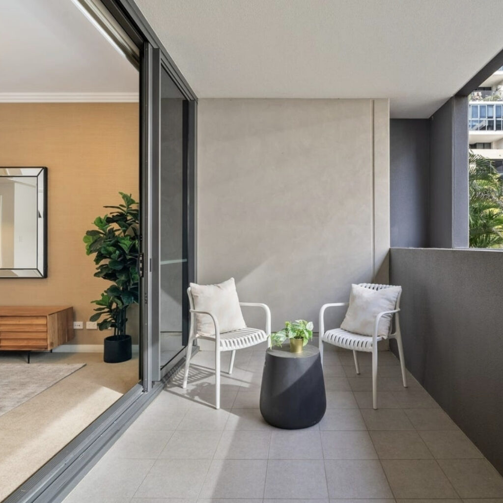 Milo Outdoor Dining Chairs placed on a modern balcony