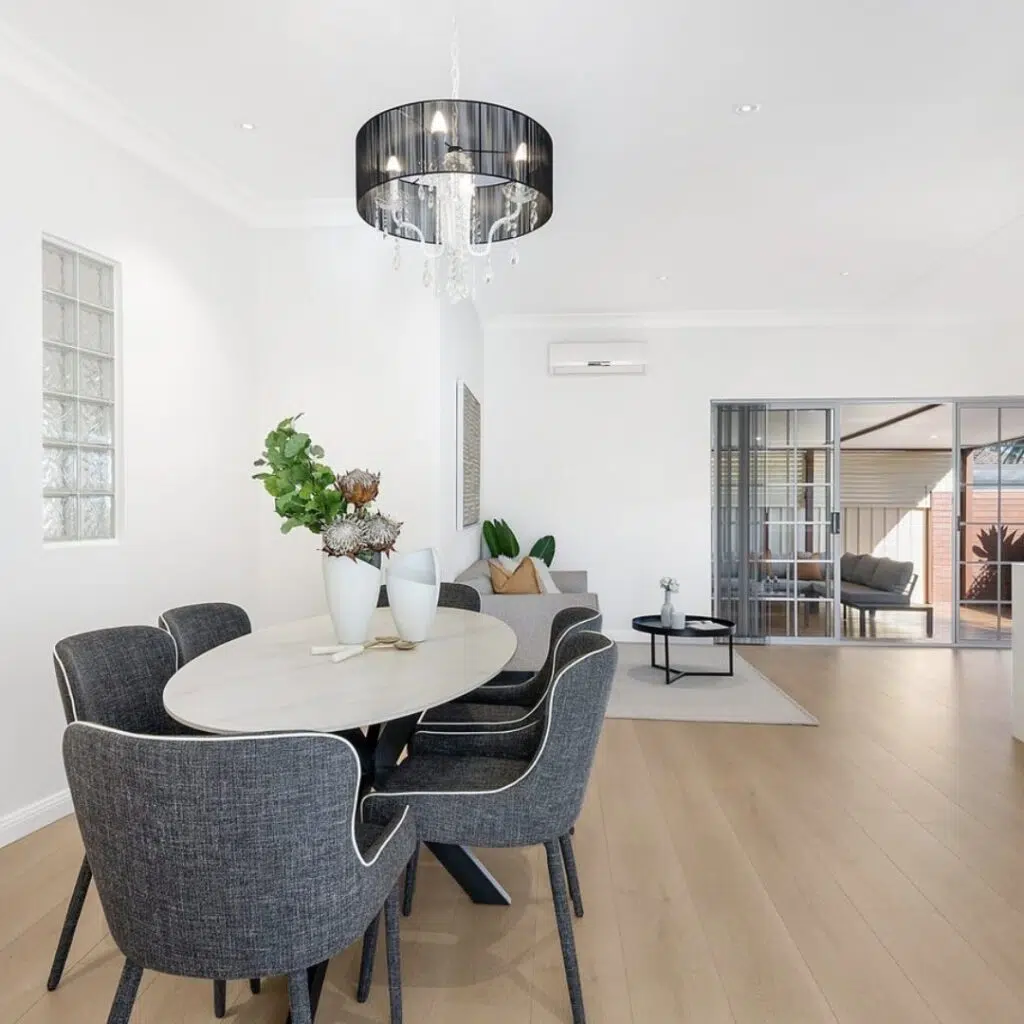 Sage Oval Modern 180cm Dining Table with grey chairs in a contemporary dining room