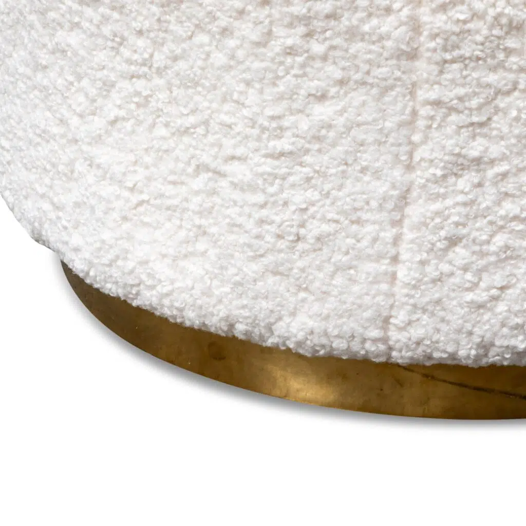 Elegant white lounge chair with brass base, modern design, plush upholstery, perfect for living spaces.