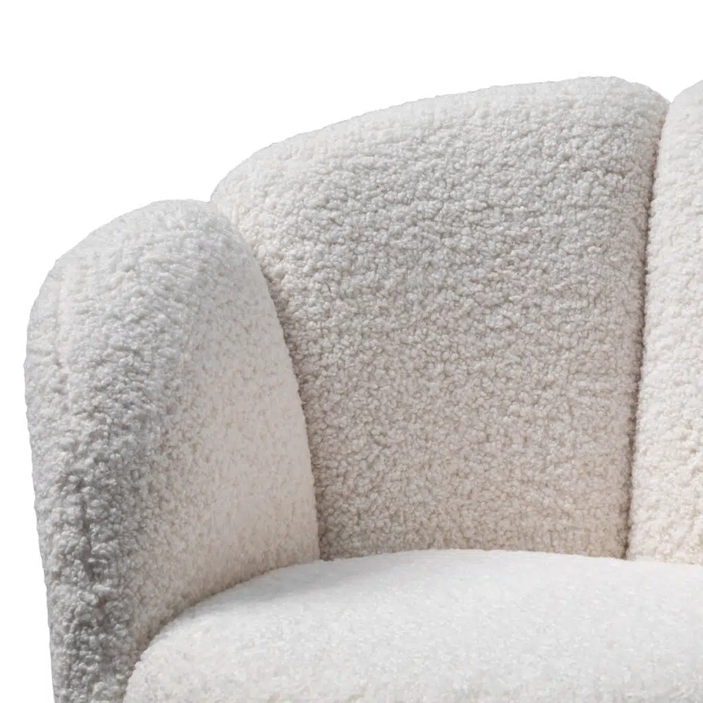 Elegant white lounge chair with brass base, modern design, plush upholstery, perfect for living spaces.