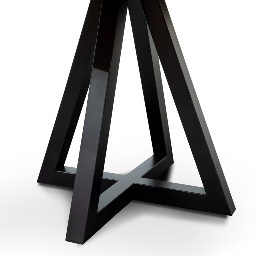 Round oak dining table with black metal legs