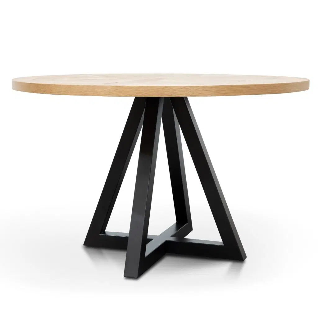 Round oak dining table with black metal legs