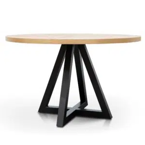Round oak dining table with black metal legs