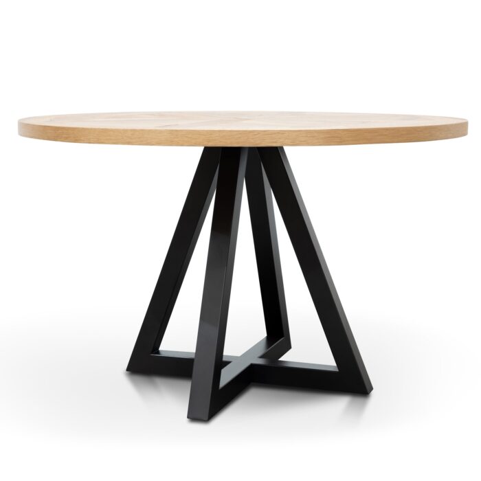 Round oak dining table with black metal legs