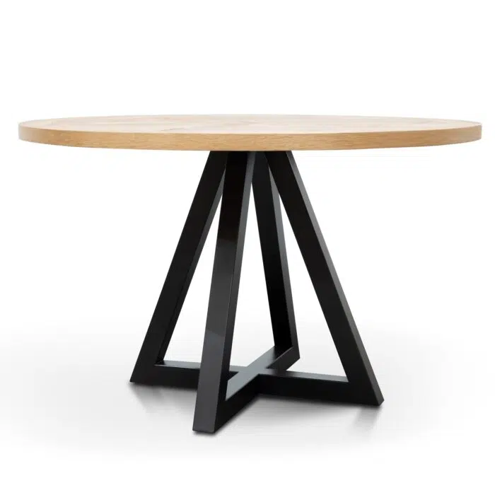 Round oak dining table with black metal legs