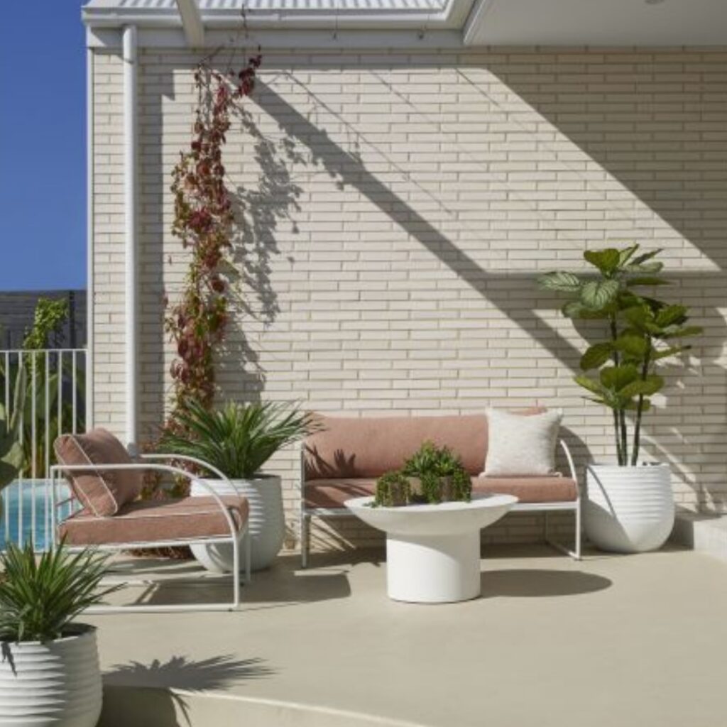 Reeve Outdoor 2 Seater Sofa Pink White, sleek design, plush cushions, elevate outdoor spaces.