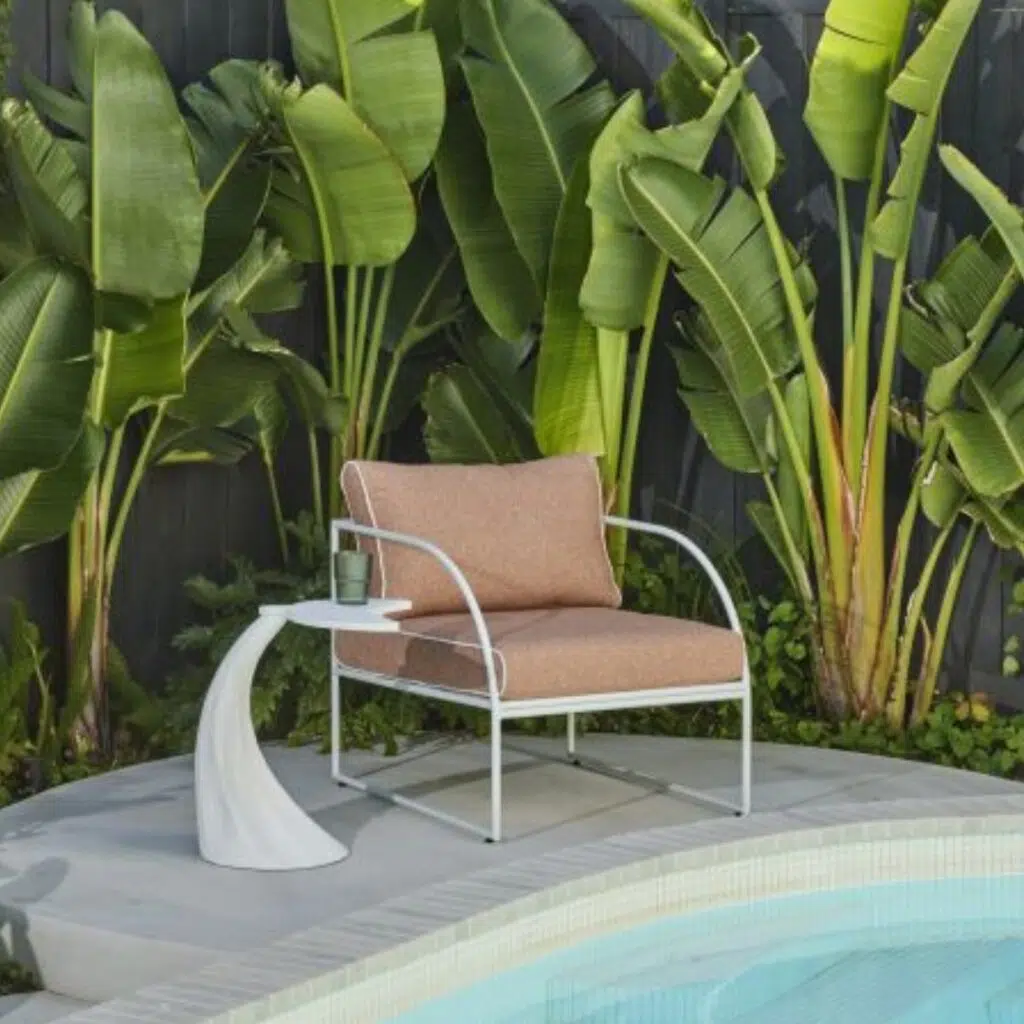 Reeve Outdoor Arm Chair Pink White, stylish minimal frame, plush cushions, elevate patio decor