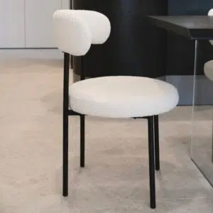 Arco boucle dining chair in cream fabric with modern design and sturdy metal frame