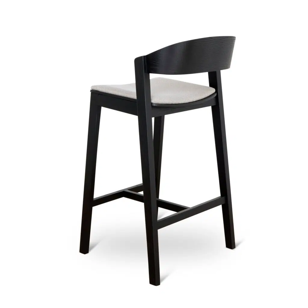 Modern black bar stool with grey fabric, ergonomic design, sturdy timber construction.