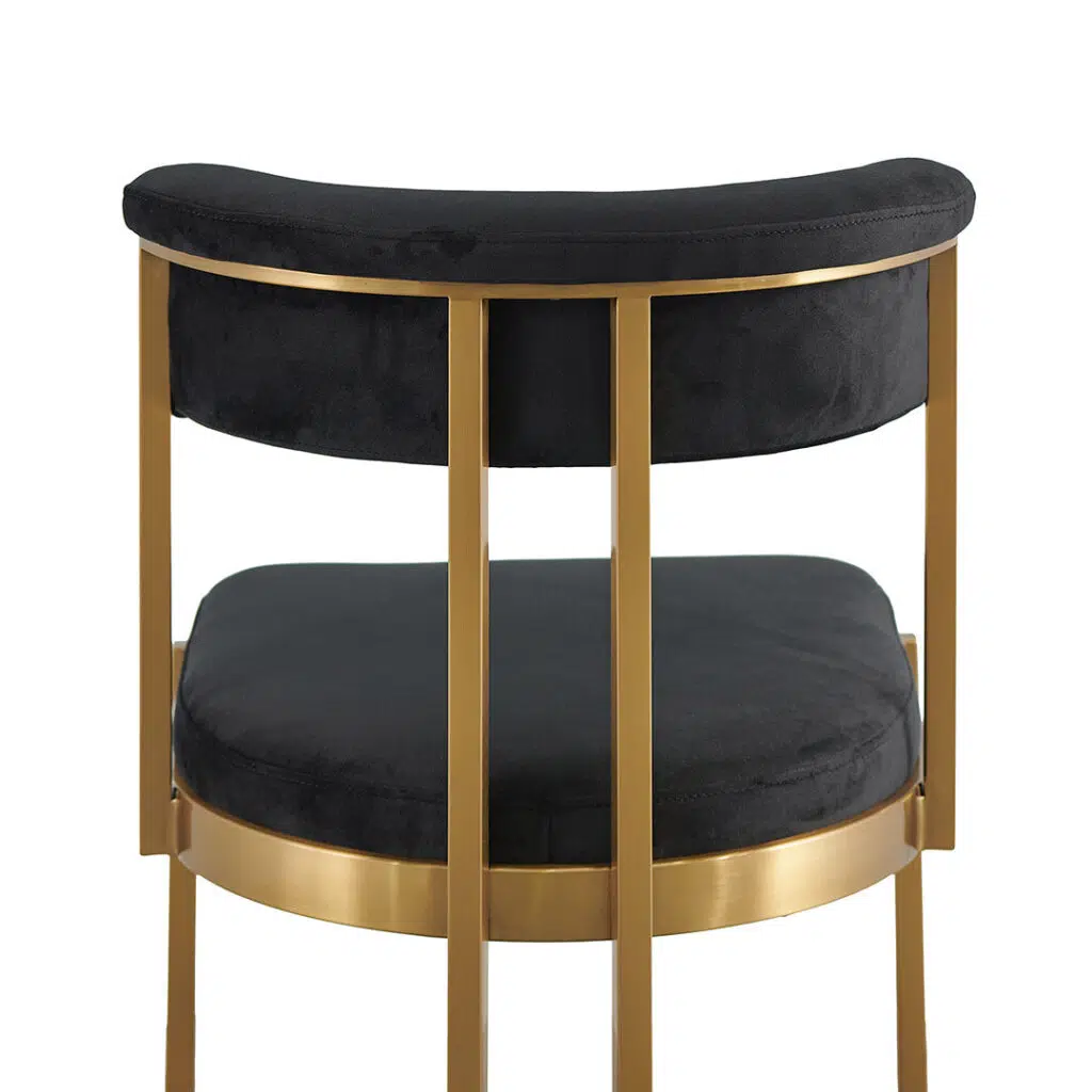 Luna black velvet dining chair with golden base, sleek silhouette, and U-shaped leg.