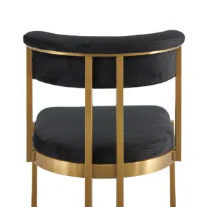Luna black velvet dining chair with golden base, sleek silhouette, and U-shaped leg.