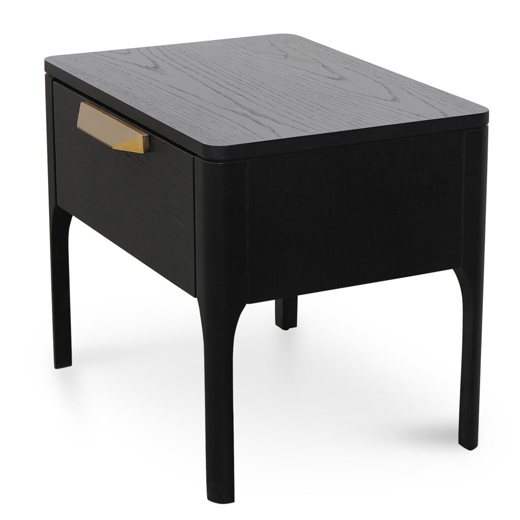 Modern black veneer bedside table with brass handle, ideal for minimalist bedrooms.