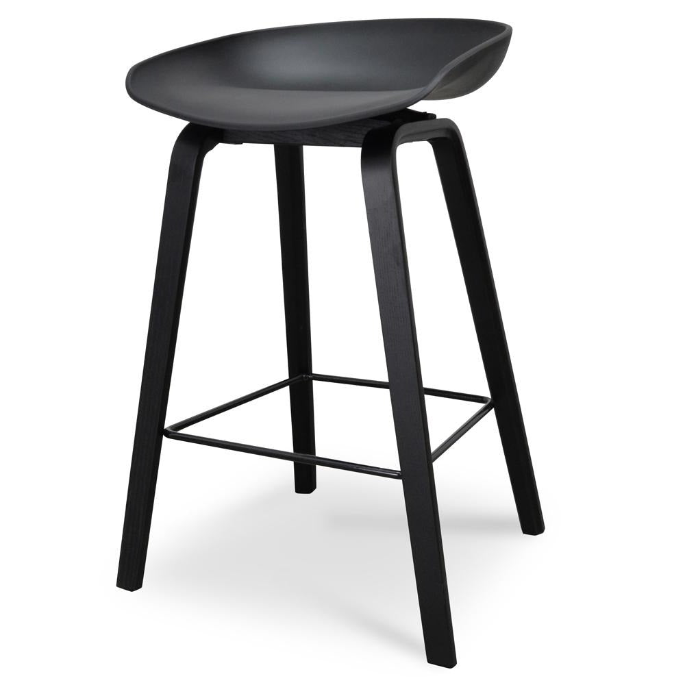 Modern black 65cm bar stool with footrest and ergonomic seat for comfortable dining.