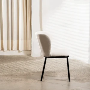 White Alaska dining chairs with boucle fabric and black metal frame for modern spaces