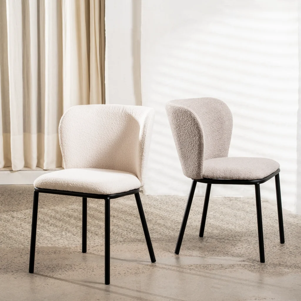 Modern latte boucle dining chairs with black powder-coated frame for versatile interiors