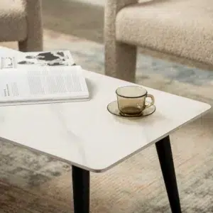 Bentley coffee table with snow white ceramic top and black metal legs for modern homes