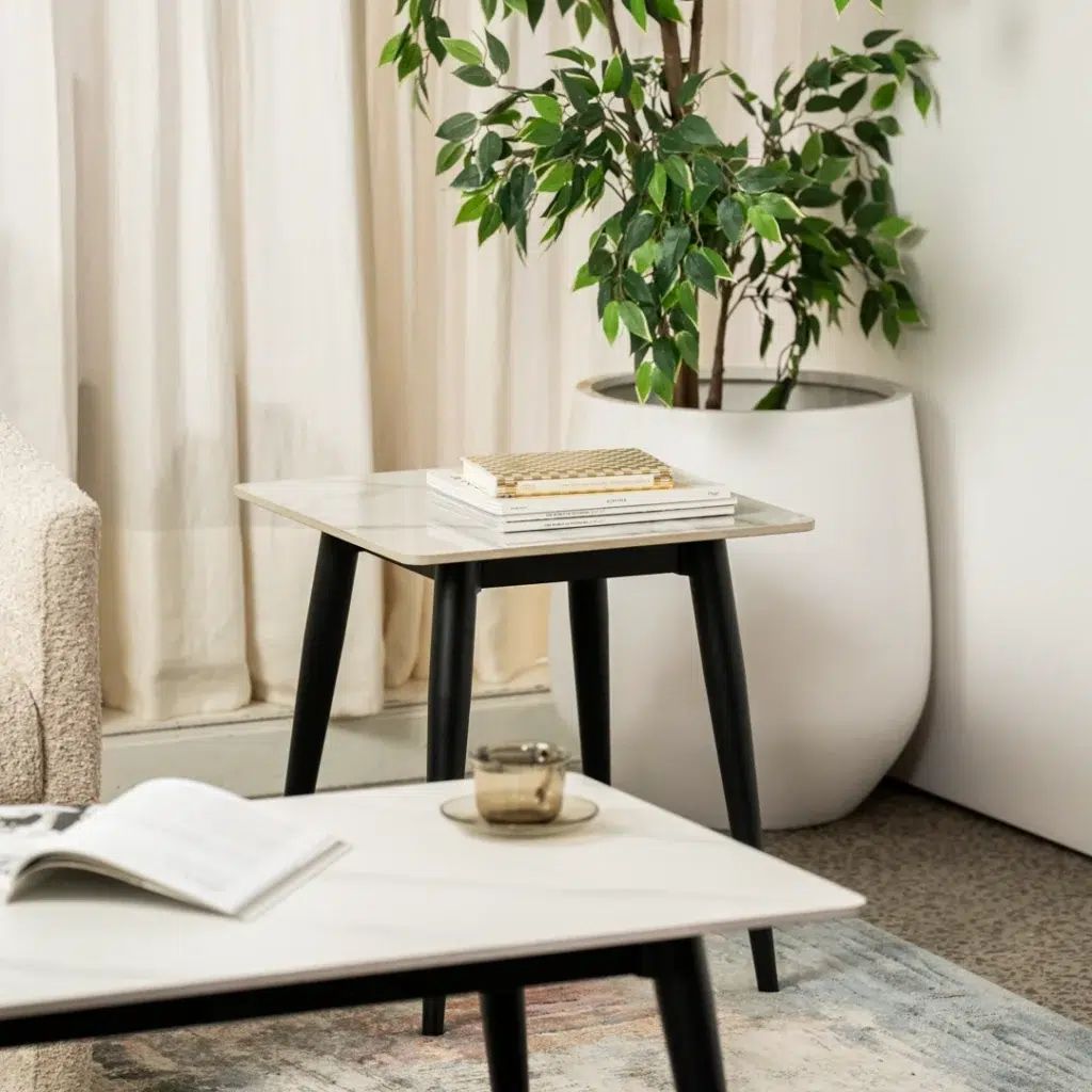 Bentley side table in snow white ceramic with black metal legs for modern spaces