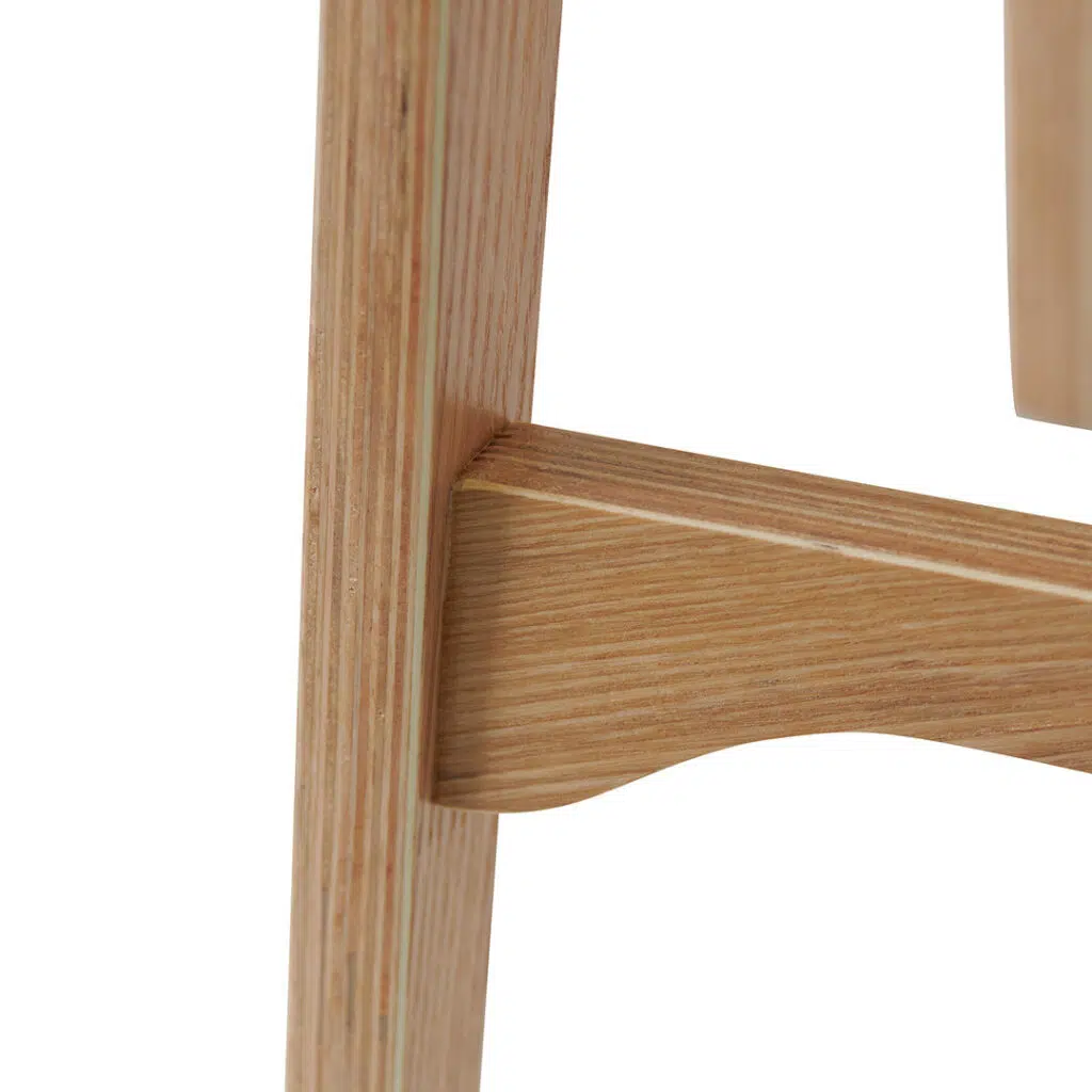 Natural wood bar stool with ergonomic design and sleek frame for modern kitchens