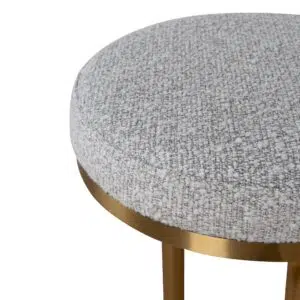 Brushed gold bar stool with silver grey boucle upholstery and ergonomic design