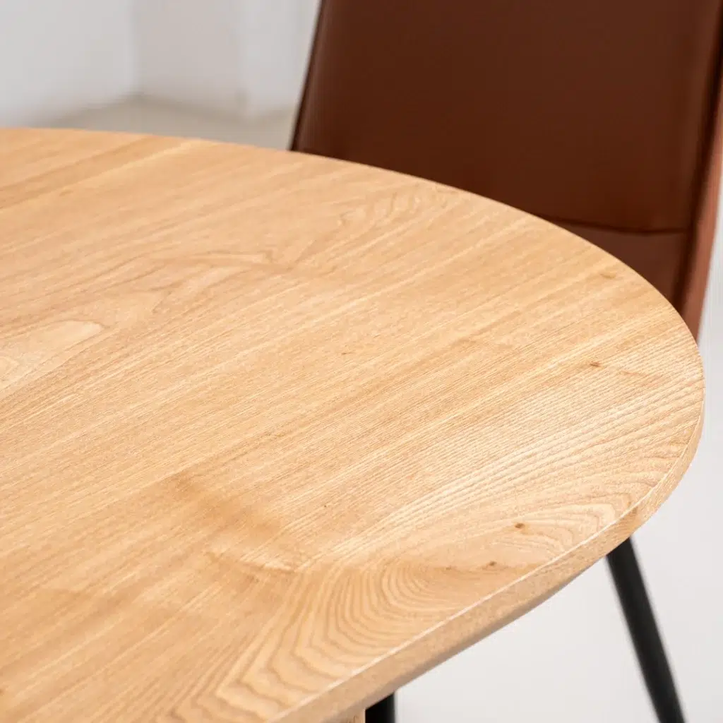 Ash veneer Boyd dining table with honey tones and matte finish for modern spaces