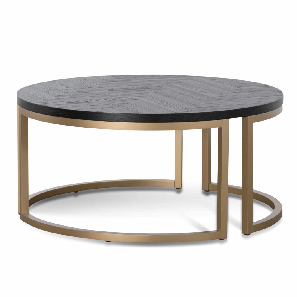Cyrus round coffee table with peppercorn finish and brass base for modern living rooms