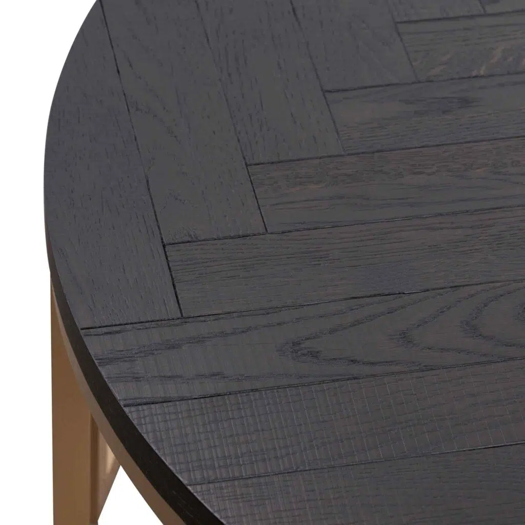 Cyrus round coffee table with peppercorn finish and brass base for modern living rooms