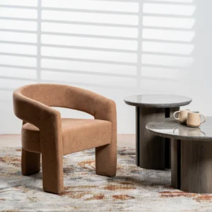 Calgary occasional chair in coral boucle fabric with modern sculptural design