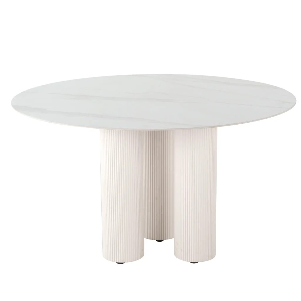 White round dining table with marble-inspired ceramic top and sculpted column base
