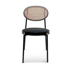 Black powder-coated dining chair with gold accents and natural rattan backrest for modern interiors