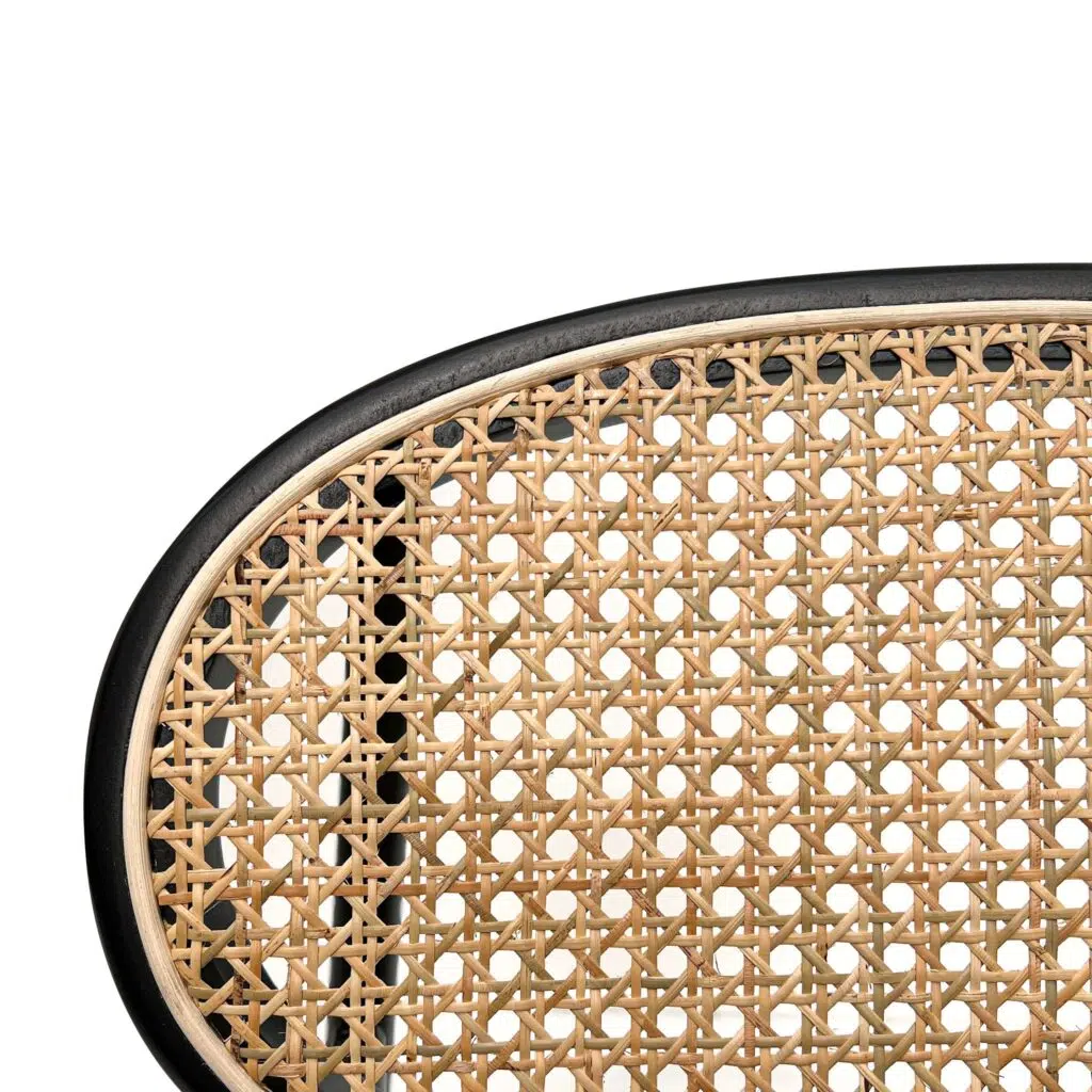 Violet fabric dining chair with black metal frame and natural rattan backrest for modern interiors