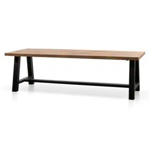 Talia outdoor dining table with natural acacia wood top and black steel base for modern spaces