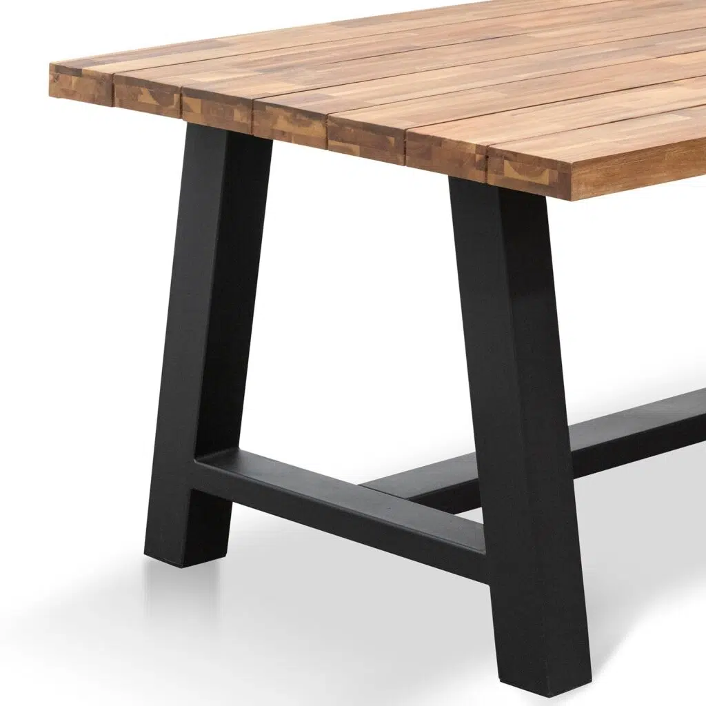 Talia outdoor dining table with natural acacia wood top and black steel base for versatile use