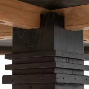 Round dining table in natural elm with black base for rustic modern charm