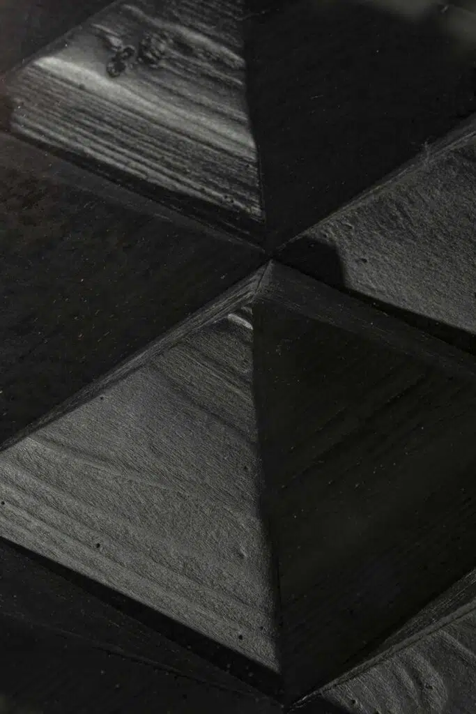 Arlo 1.2m full black elm coffee table with industrial-modern design and geometric details