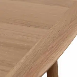 Extendable dining table in natural wood with tapered legs and soft edges for modern homes