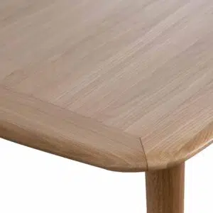 Natural wood poppy extendable dining table with tapered legs and organic textures