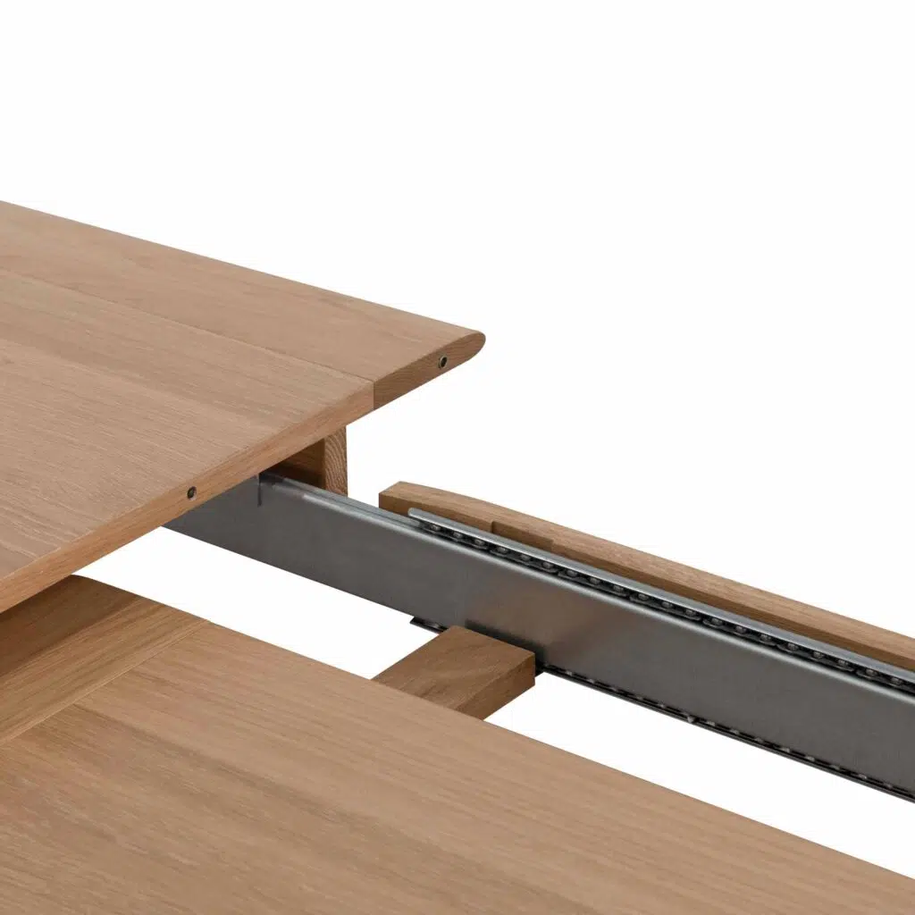Natural wood extendable dining table with tapered base and soft edges for modern homes