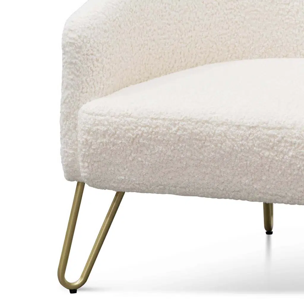Ivory white synthetic wool armchair with golden hairpin legs for modern interiors